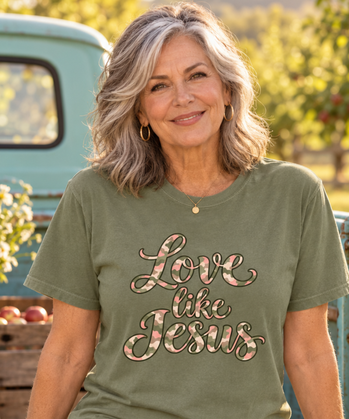 Moss Comfort Colors tee with Love Like Jesus script in pink, sage, cream, and taupe camouflage.