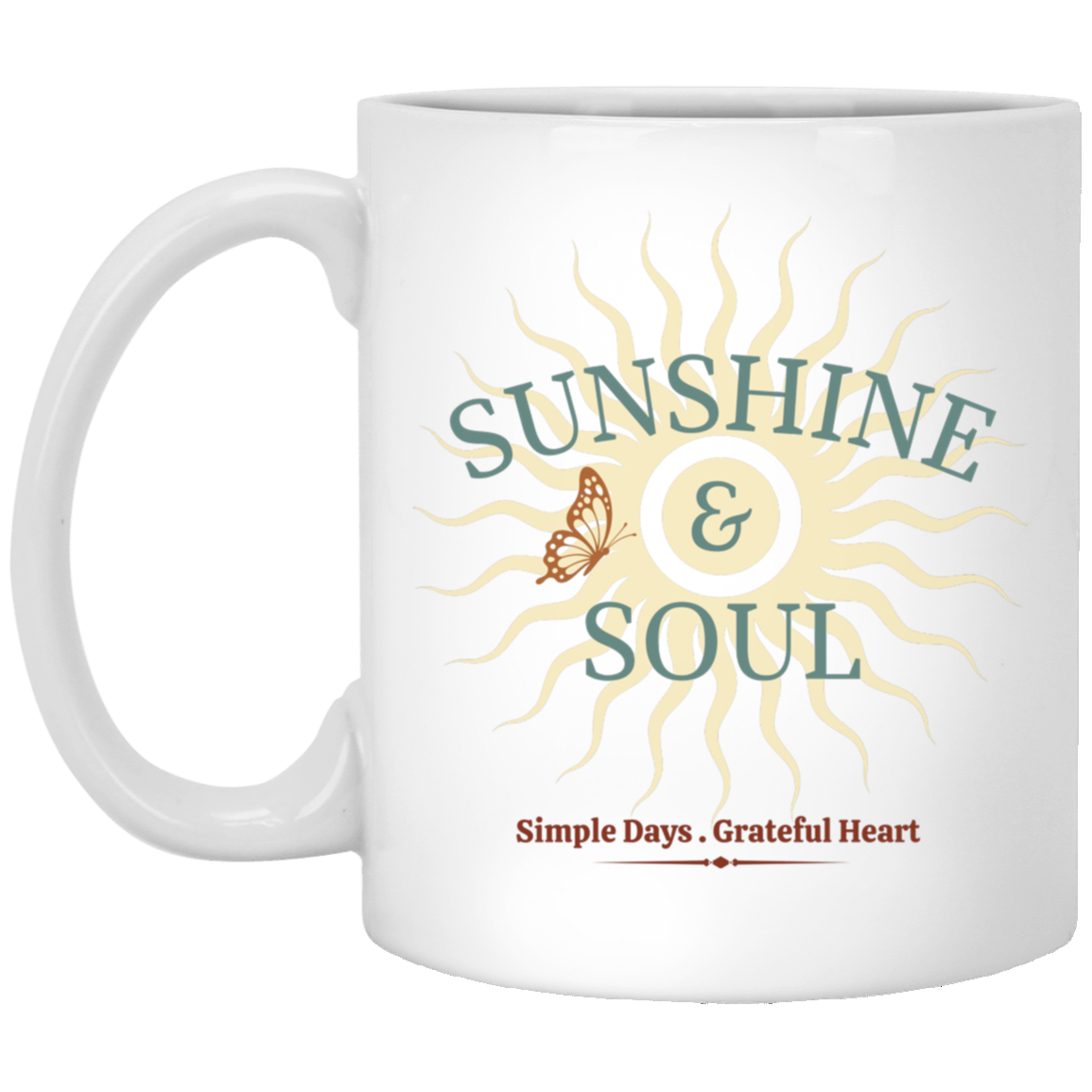 White ceramic coffee mug featuring a vintage butterfly surrounded by sun rays with the words "Sunshine & Soul" and "Simple Days. Grateful Heart."