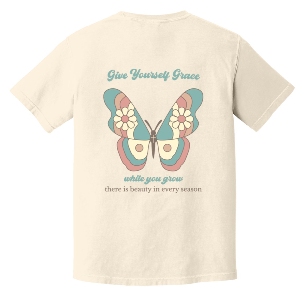 Back of Ivory Comfort Colors T-shirt with a large pastel butterfly and Give Yourself Grace While You Grow message.