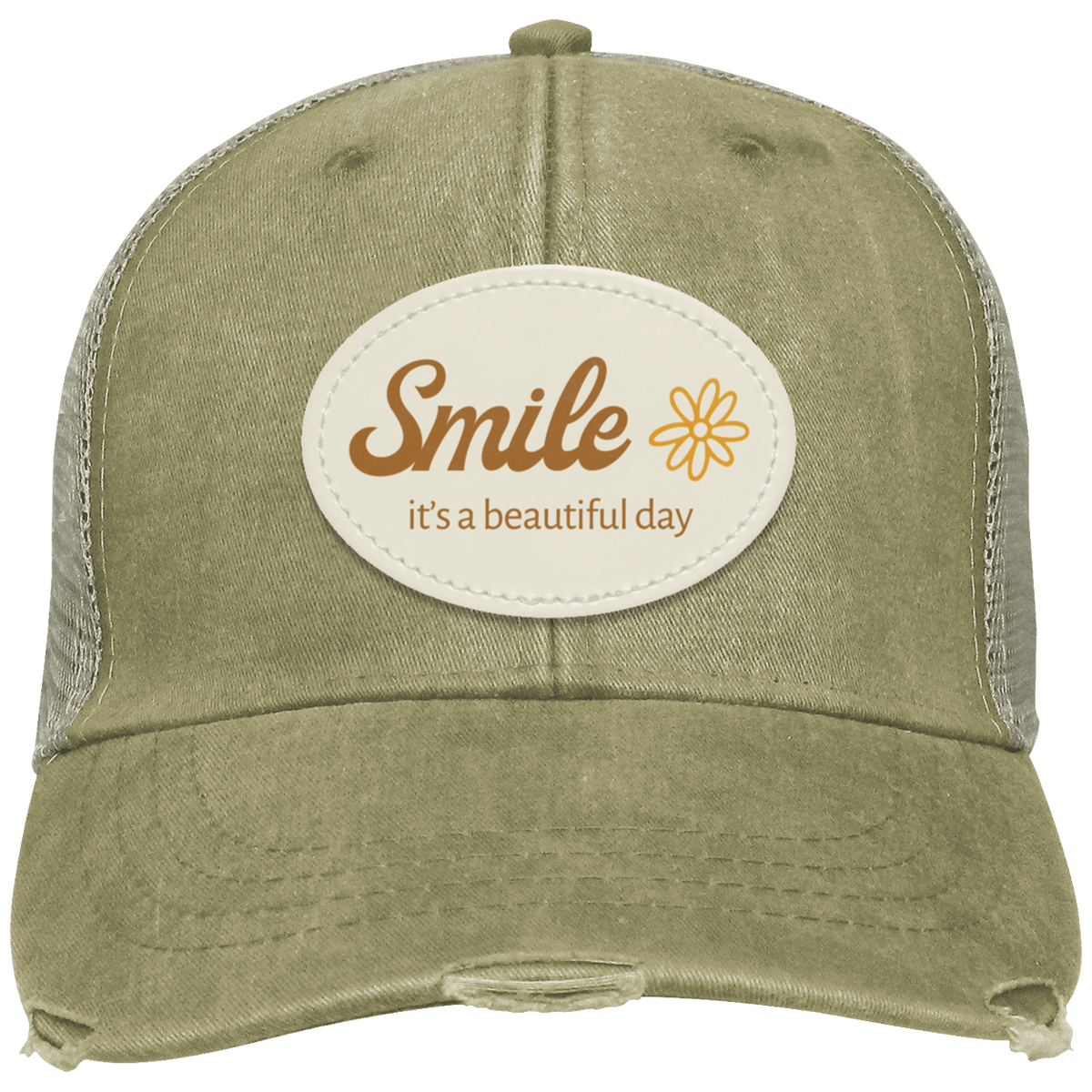 A khaki distressed trucker hat with a cream-colored oval patch on the front that reads 'Smile it's a beautiful day' in brown lettering, accompanied by a small yellow flower graphic.