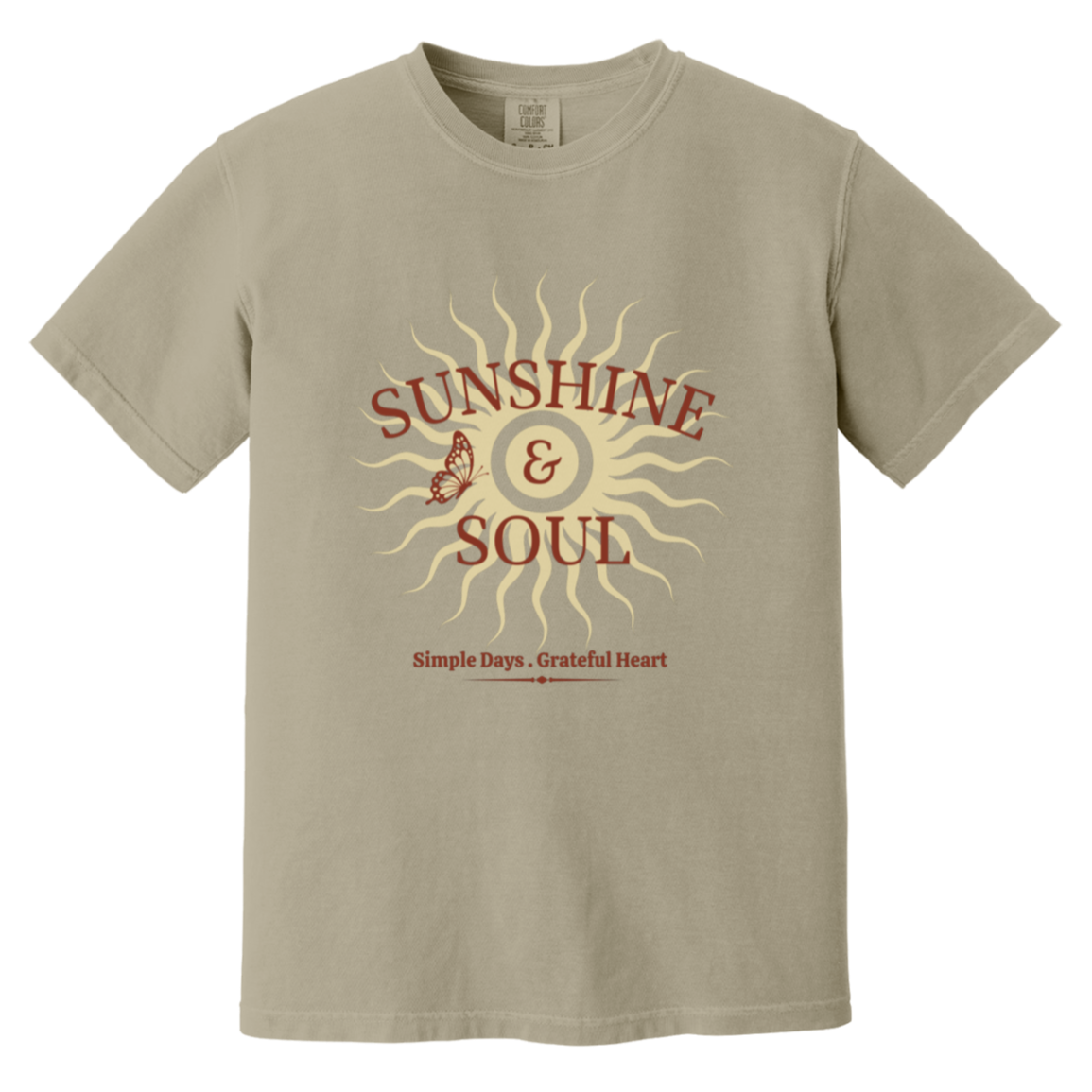 Sunshine & Soul Comfort Colors® sandstone garment-dyed t-shirt featuring a retro-inspired sunburst graphic with distressed maroon and cream lettering and the phrase "Simple Days • Grateful Heart."