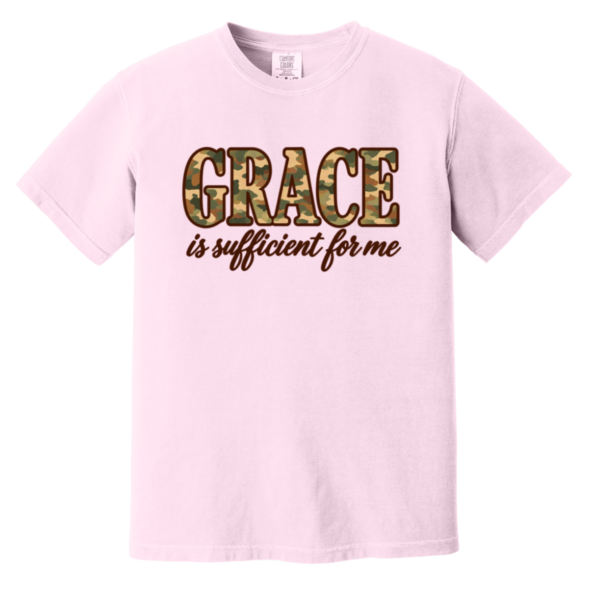 A light pink short-sleeve comfort colors t-shirt featuring a graphic on the chest. The graphic displays the word 'GRACE' in a camouflage pattern block font, with the phrase 'is sufficient for me' written below in a brown cursive script.