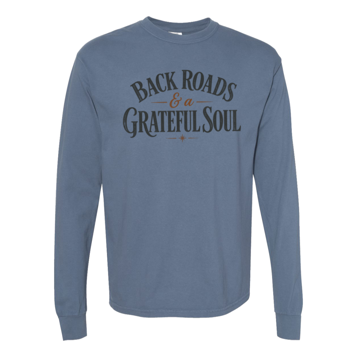 A blue jean comfort colors long-sleeve t-shirt with a distressed graphic on the chest reading 'BACKROADS & A GRATEFUL SOUL' in dark gray and brown.