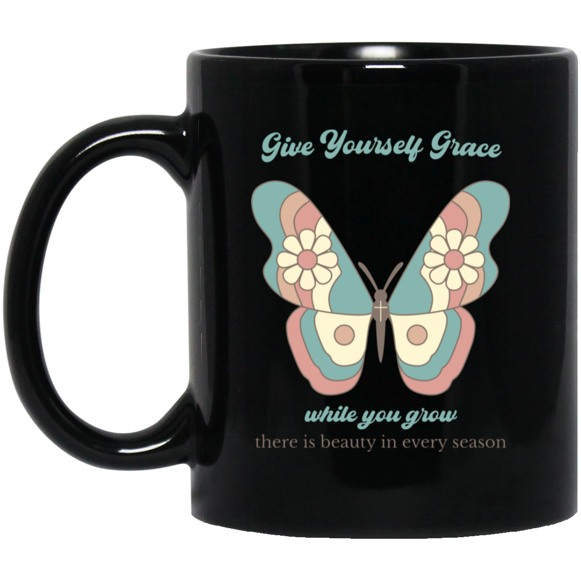 A glossy black ceramic mug featuring a pastel butterfly graphic and the text 'Give Yourself Grace while you grow there is beauty in every season'.