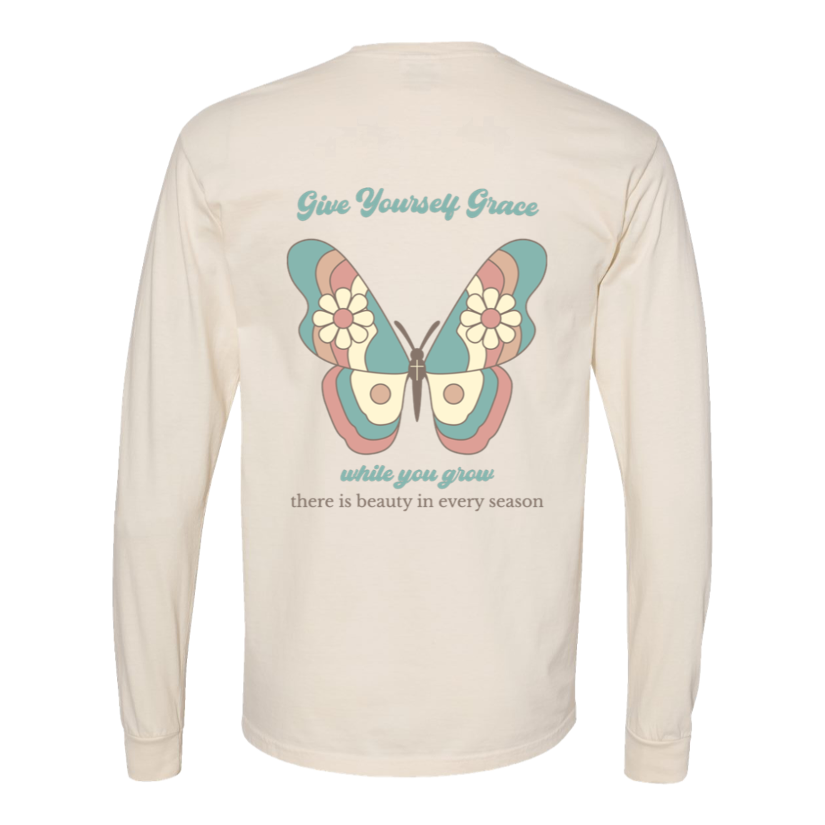 Back of Ivory Comfort Colors long-sleeve tee with a large pastel butterfly and Give Yourself Grace While You Grow message.