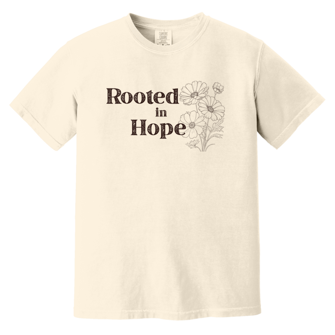 Vintage-inspired Comfort Colors ivory colored t-shirt featuring the phrase “Rooted in Hope” with soft botanical artwork in earthy muted tones.