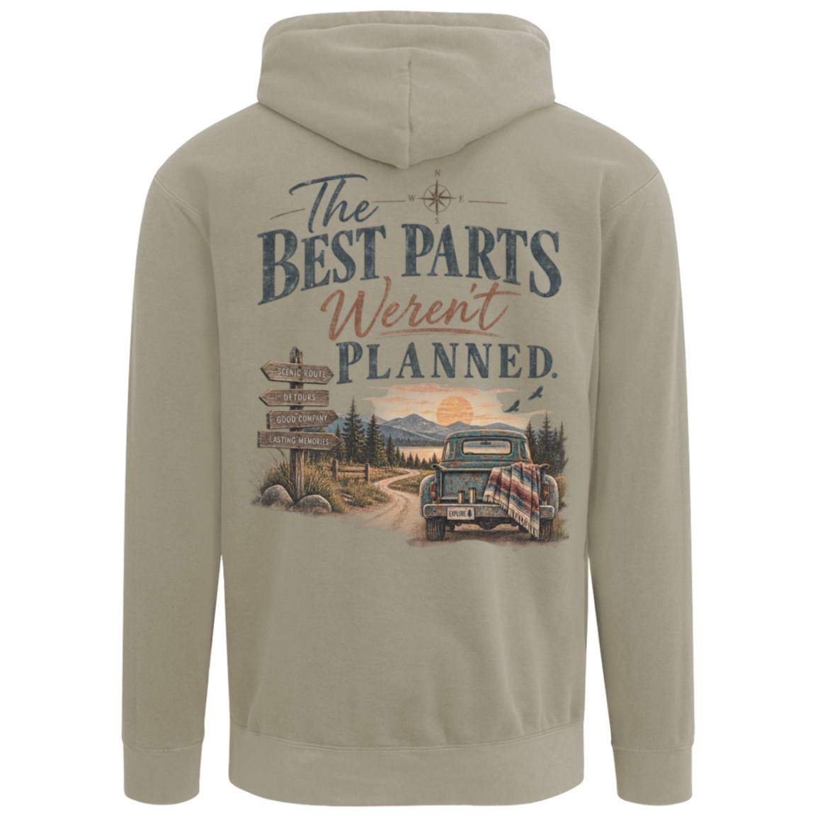 A gray comfort colors pullover hoodie shown from the back, featuring a large vintage-style graphic print with the text 'The Best Parts Weren't Planned' above an illustration of a dirt road, signpost, mountains, and a classic car.