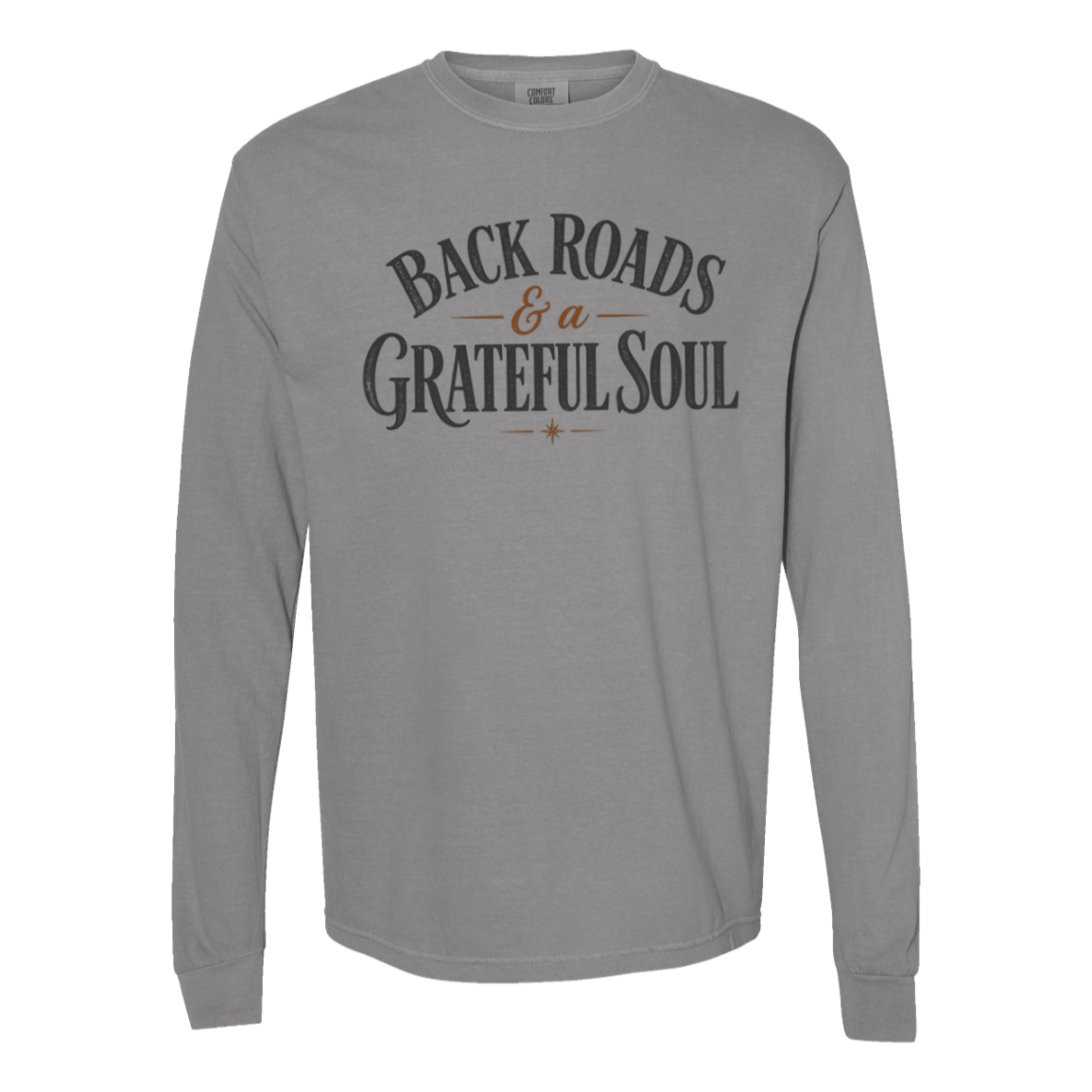 A gray comfort colors long-sleeve t-shirt with a distressed graphic on the chest reading 'BACKROADS & A GRATEFUL SOUL' in dark gray and brown.
