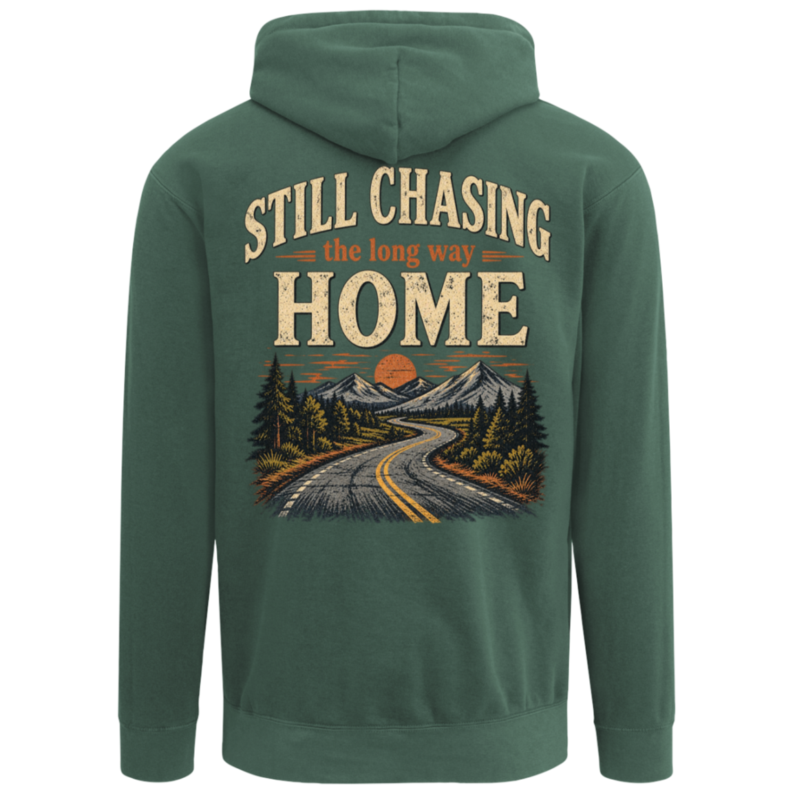 A blue spruce green pullover hoodie shown from the back, featuring a large graphic print with the text 'STILL CHASING the long way HOME' above an illustration of a winding road, pine trees, mountains, and an orange sunset. Includes front left chest design.