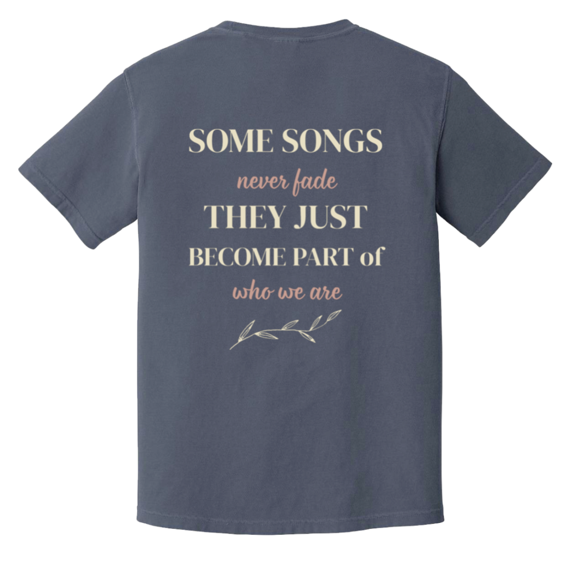 Vintage-inspired back print on the color Denim Comfort Colors t-shirt featuring the quote "Some Songs Never Fade They Just Become Part of Who We Are" with elegant typography and botanical accent. 