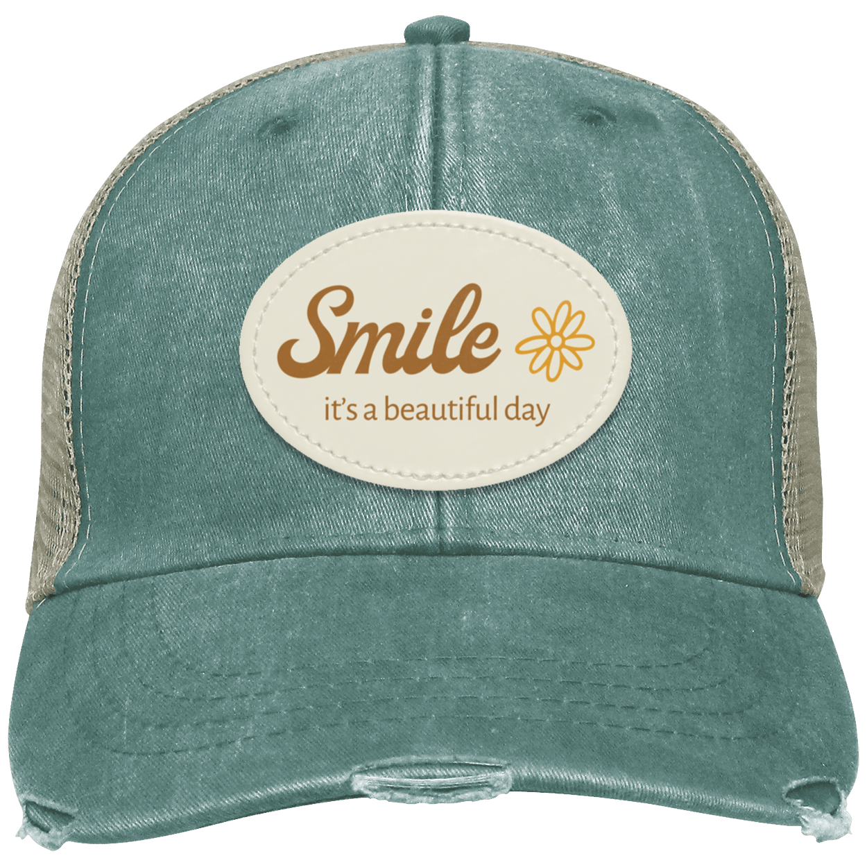 A distressed trucker-style cap in washed forest with tan mesh side panels and a cream oval patch on the front that reads 'Smile it's a beautiful day' with a small flower graphic.
