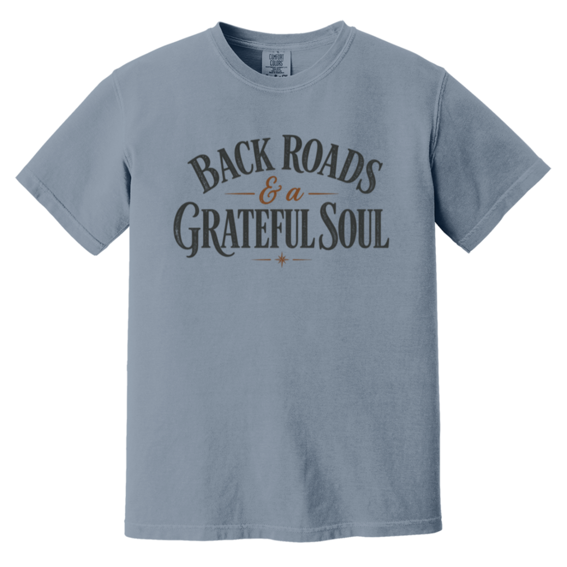 A blue jean crewneck t-shirt with a graphic print on the chest reading 'BACK ROADS & a GRATEFUL SOUL' in dark gray and brown lettering.
