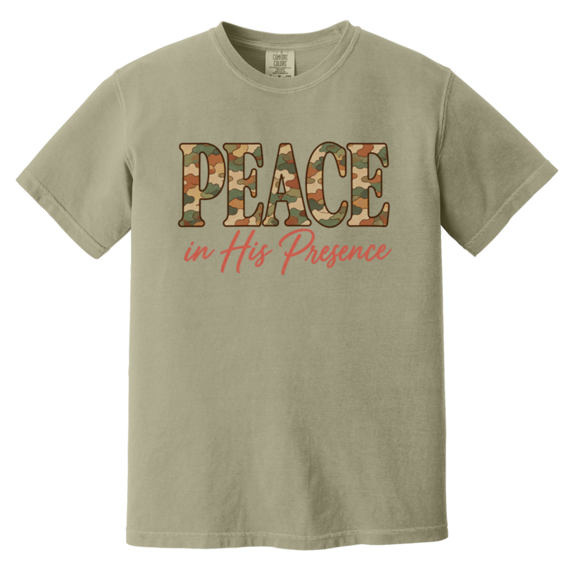 A khaki comfort colors t-shirt featuring a graphic on the chest with the word 'PEACE' filled with a camouflage pattern and the phrase 'in His Presence' written below in coral script.