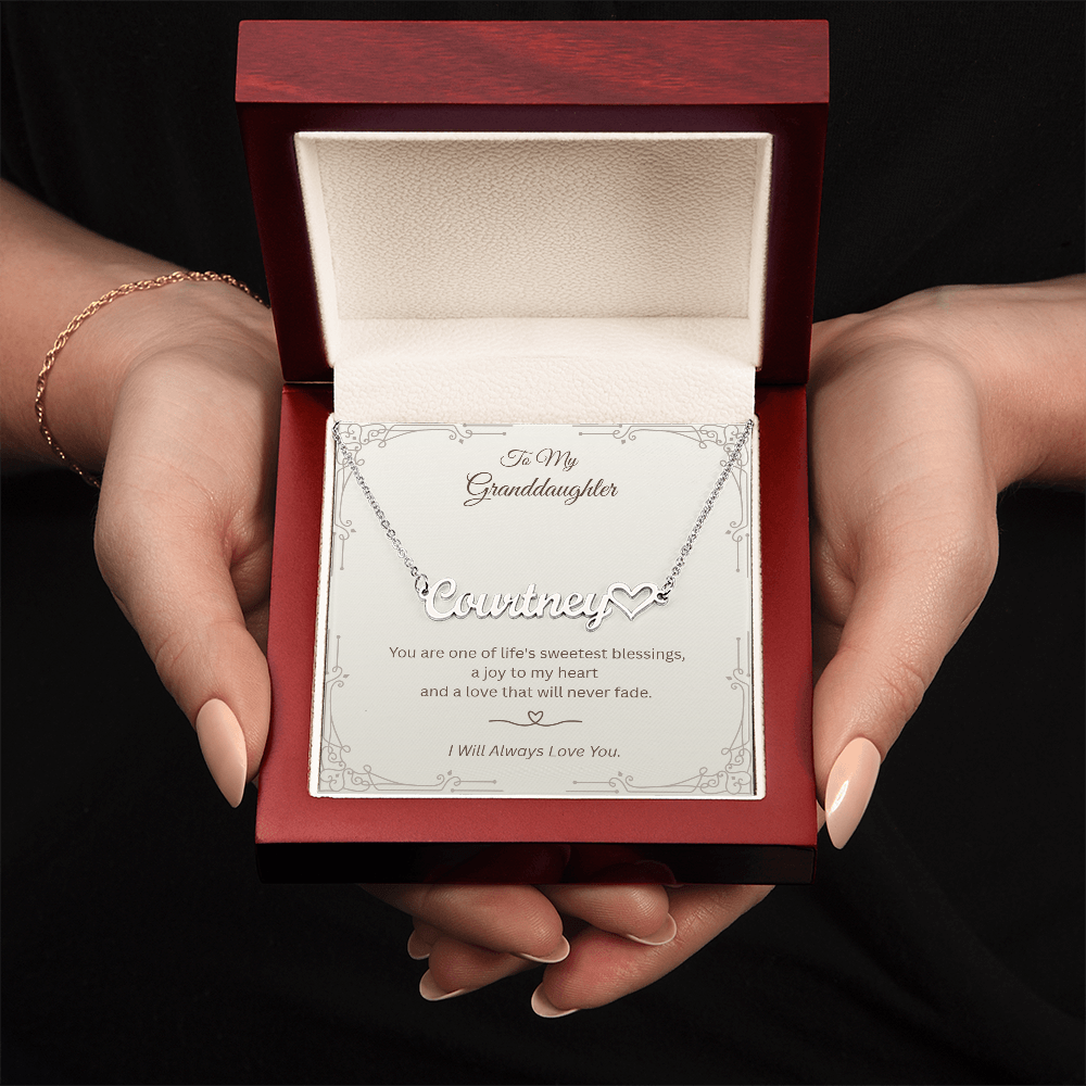 Hand holding luxury gift box with granddaughter necklace