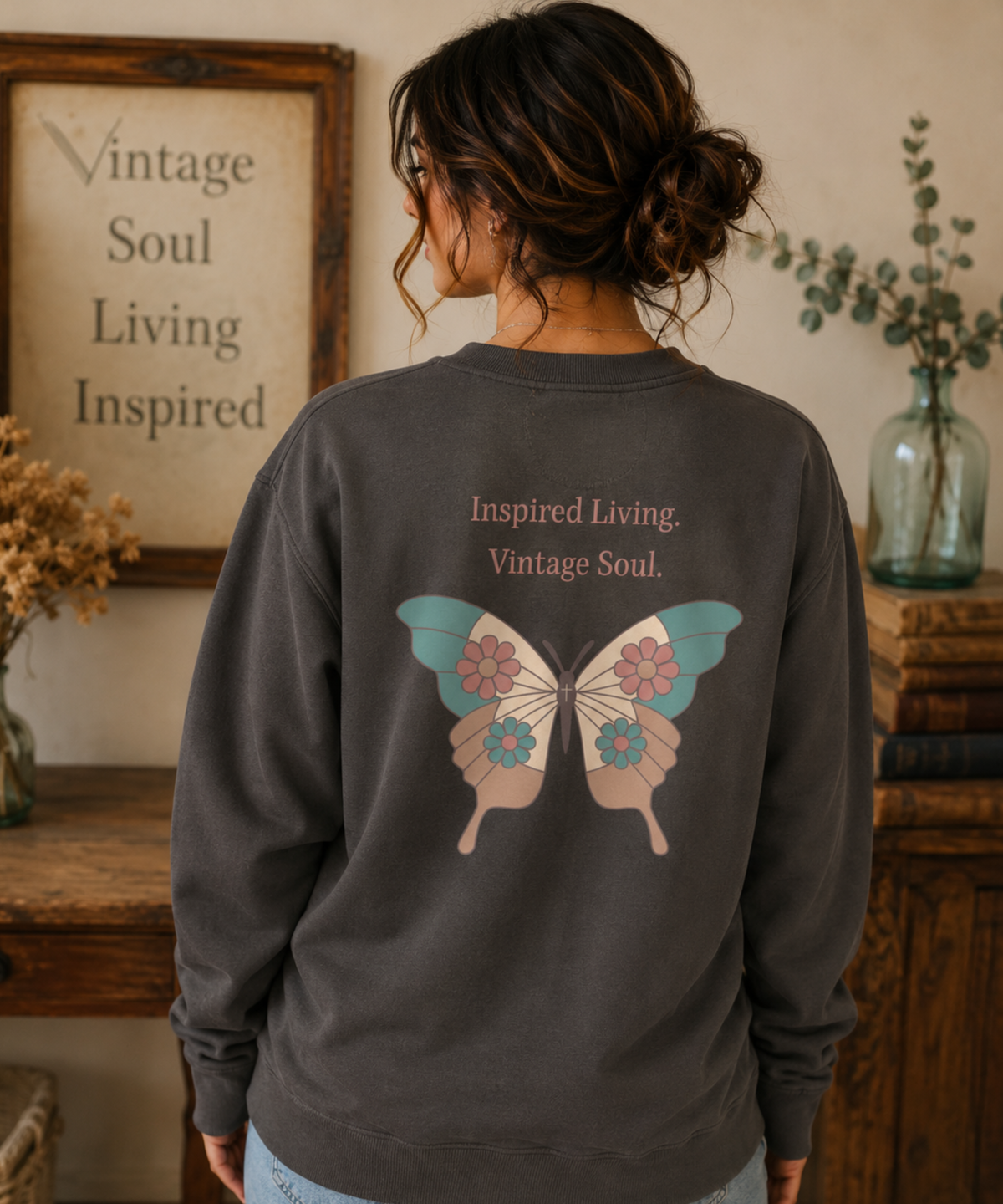 Back view of a Comfort Colors Pepper crewneck sweatshirt featuring the Inspired Living. Vintage Soul. butterfly back design in a cozy vintage-style setting.