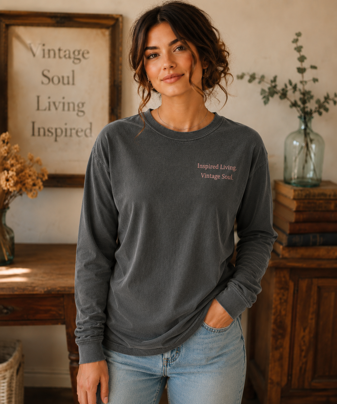 Woman wearing a Comfort Colors Pepper long sleeve T-shirt featuring the Inspired Living. Vintage Soul. left chest design in a warm vintage-inspired setting.