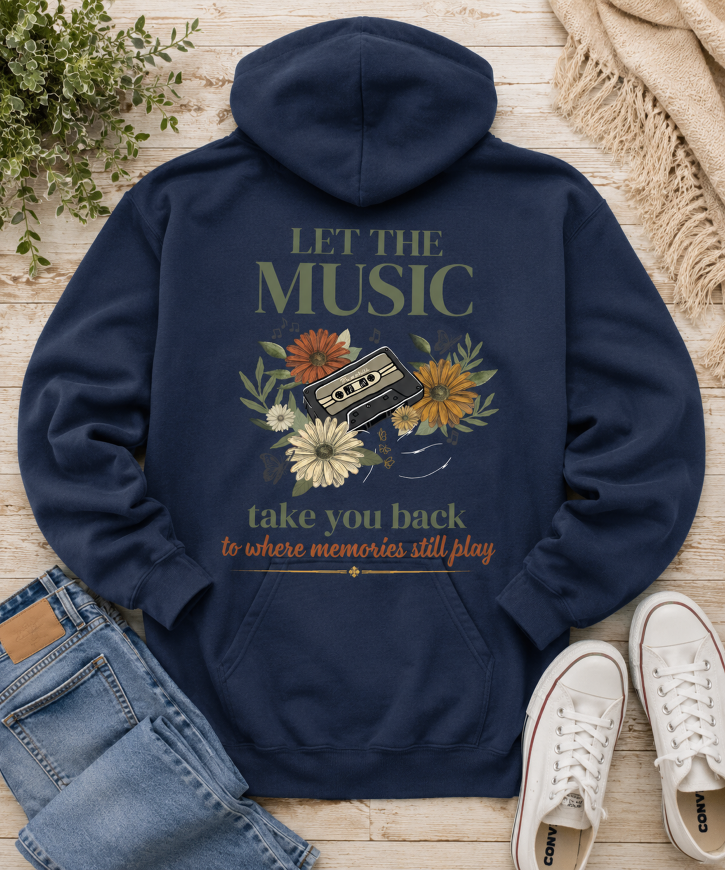 Comfort Colors True Navy hoodie flat lay featuring the Let the Music Take You Back vintage cassette and floral back design with nostalgic music-inspired artwork on the back. The front has a left chest butterfly.