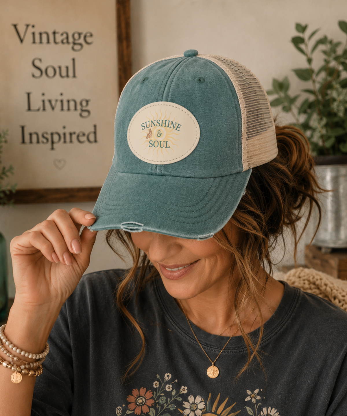 A lady wearing this vintage forest distressed trucker cap featuring an original Sunshine & Soul sublimated vegan leather patch with breathable mesh back and adjustable snapback closure.