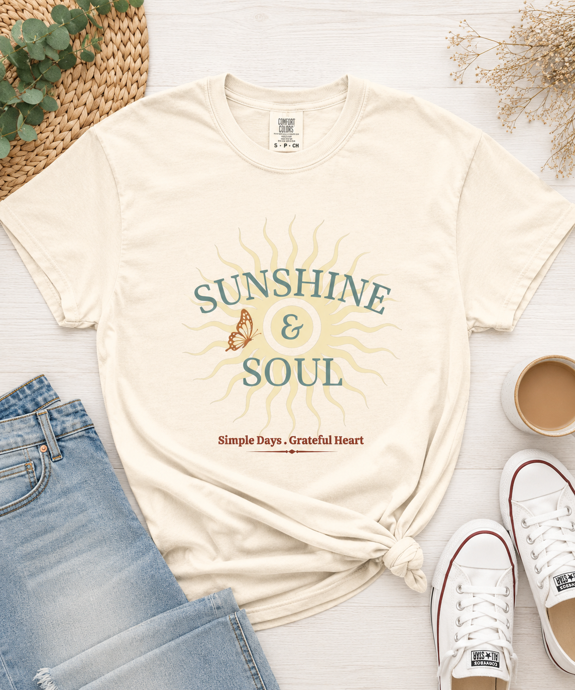 Flat lay of Sunshine and Soul Comfort Colors t-shirt featuring vintage sun rays and Simple Days Grateful Heart design